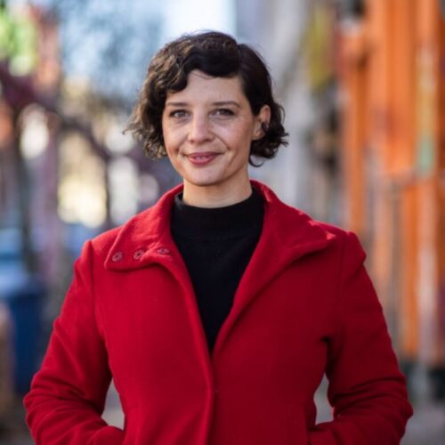 a woman in a red coat